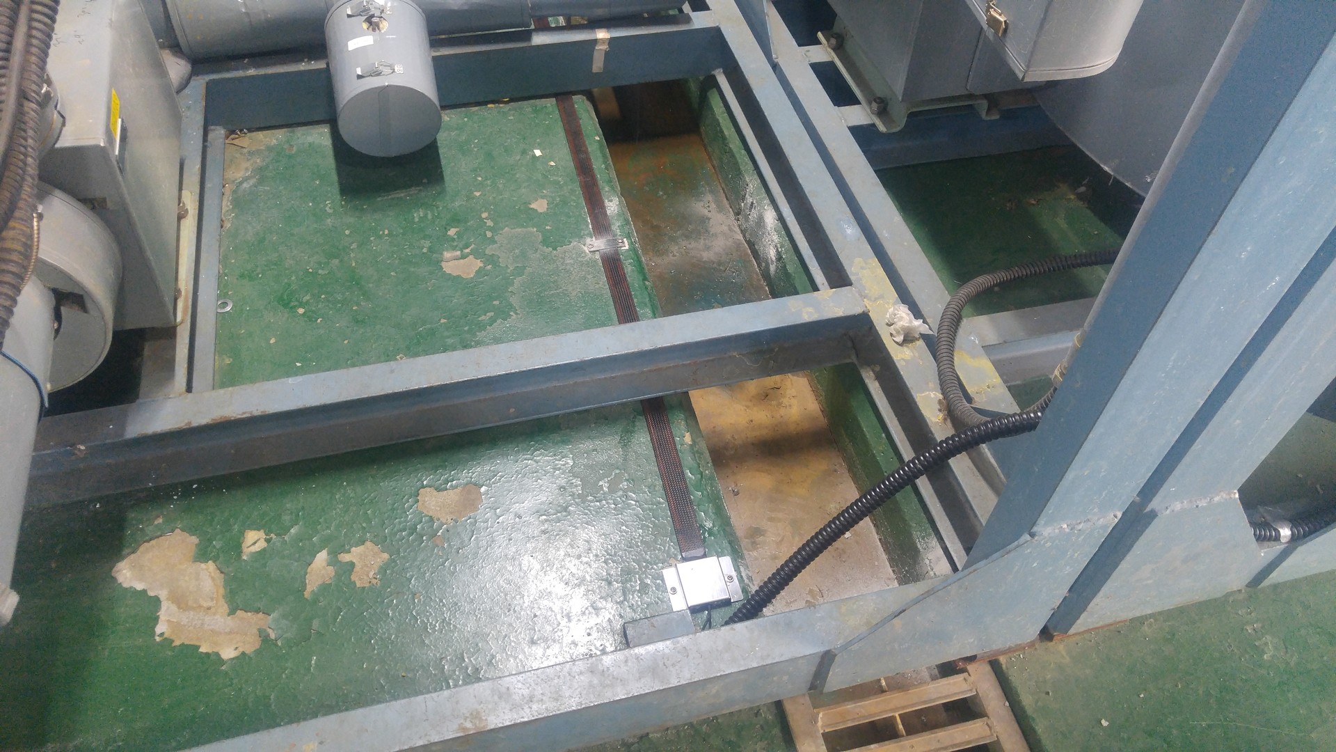 Leak detection cable installed below an equipment base frame